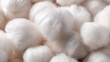 © AndyAziz - Soft, fluffy, white cotton balls showcasing their fibrous texture and smooth appearance