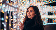 © ณภัทร วงค์มาวิวัฒน์ - Radiant Reflection: A young woman is illuminated by the warm, inviting glow of festive lights, reflecting on a magical, memorable moment.