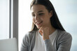 © fizkes - Motivation and productivity. Close up portrait smiling young woman high school student office worker watch online webinar ponder ideas engaged in elearning education course looking at notebook screen