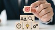 © resky - Business Strategy Goal Achievement with Wooden Blocks and Icons.