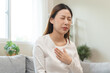 © Pormezz - Acid reflux disease, suffer asian young woman have symptom gastroesophageal, esophageal, stomach ache and heartburn pain hand on chest from digestion problem after eat food, Healthcare medical concept