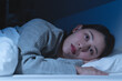 © Pormezz - Anxiety disorder on insomnia woman concept, sleepless Woman open eye awakening on the bed at night time can't sleep from symptom of depression diseased.