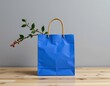 © CRISPIFLY - Bright Blue Shopping Bag with Green Foliage and Berries