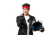 © luismolinero - Young caucasian man with a motorcycle helmet over isolated background doing coming gesture