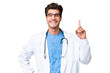 © luismolinero - Young doctor man over isolated background showing and lifting a finger in sign of the best