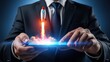 © Lucky.STD - Businessman launches rocket from glowing smartphone screen held by hands.