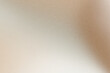 © colnihko - Soft beige and brown gradient background creating subtle texture with analog film grain effect
