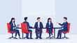 © StockStudio - Diverse business team in a meeting, discussing and collaborating at a table.