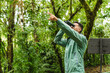 © STOCKEROcr - Young male birdwatcher pointing and using binoculars in Monteverde Cloud Forest Costa Rica