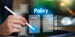 © chaylek - Business professional reviewing digital policy documents with checklist system. Represents corporate policy management, compliance control, internal guidelines, approval workflow, and governance.