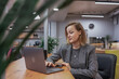 © svetograph - Woman laptop office: Focused professional business entrepreneur uses computer at modern workspace desk
