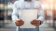 © NoorArt Studio - Man holding a document with digital icons overlay