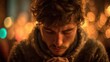 © Thanaporn - Man Praying in Front of Cross with Bokeh Lights