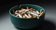 © tpadobestock - A close-up shot of a messy, overflowing ceramic ashtray filled with numerous smoked cigarette butts, indicating heavy consumption and waste ,texture ,addiction ,closeup