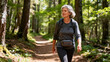 © Olia - Middle-aged woman in menopause hiking confidently on a forest trail, carrying a backpack and embracing endurance, independence, and connection with nature