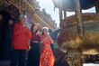 © Velocitystock777 - Family paying respect and praying for blessings at a Chinese temple