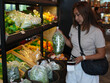 © sittinan - young woman shopping in supermarket
