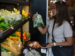 © sittinan - young woman shopping in supermarket