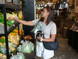 © sittinan - young woman shopping in supermarket