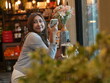 © sittinan - woman relax in cafe and use smartphone