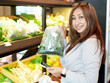© sittinan - young woman shopping in supermarket