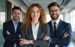 © handong - Smiling business people looking at camera and posing in office. Confident businesspeople standing with their arms crossed. Business colleagues and team concept. Front view. High quality