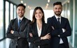 © ling - Three business people standing with their arms crossed in office. High quality