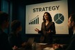 © Loginova - Female executive presenting company strategy to colleagues in boardroom with charts on screen, explaining growth and marketing goals.