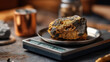 © Denis Yevtekhov - Pure gold ore from mine placed on weighing scale for evaluation, precious metal measurement, mineral weight assessment, raw gold quantification, mining industry valuation, with copy space