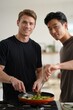 © Aliaksandr Barouski - Two men cooking together in a bright kitchen, smiling partners preparing a meal