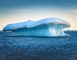 © Dean - icy iceberg with arctic mushroom shape drifting on sea snow albedo