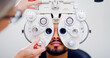 © Kobus L/peopleimages.com - Optometrist, man or patient with eye exam machine, vision test or determine prescription for clear sight. Assessment, optometry or people with lens selection on phoropter, consultation or portrait
