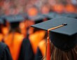 © Pete - Graduates in mortarboard hats and academic robes celebrate achievement. Students toss caps in air, receive diploma, marking end of university education. Joyful event honors academic success.