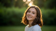 © Admint - Natural outdoor portrait of a smiling teenage girl standing in soft shade at a park