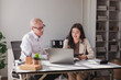 © crizzystudio - Multi generational business team collaborating in office