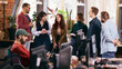© master1305 - Team conversation in relaxed modern coworking office. Concept of healthy modern work environment, stress reduction, sustainable productivity, employee wellbeing.