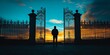 © bborriss - Man standing at open gate during sunset contemplating freedom and opportunities