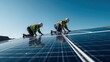 © Hitesh - Renewable energy concept showing technicians mounting photovoltaic solar panels on a rooftop during a clear sunny day with sun flare.