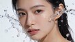 © Yka - 水しぶきの中でこちらを見つめる美しい肌の日本人女性