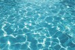 © pantila - Top view of swimming pool water with shining bright light