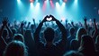 © Viktor - Crowd enjoys live music concert. People raise hands, one makes heart shape. Bright stage lights illuminate a packed venue with joyful atmosphere. Fan experiences music event.