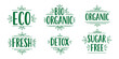 © drawing lines - Set of hand-drawn green typographic labels promoting eco-friendly, organic, and bio products with leaf accents