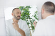 © auremar - man with towel after shaving his beard