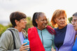 © Sabrina - Happy multiracial senior women having fun hugging each other after yoga workout at city park - Healthy elderly lifestyle and sport concept