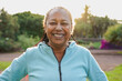 © Sabrina - Fit african senior woman smiling on camera after running morning routine at city park - Healthy elderly lifestyle and sport concept