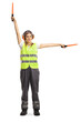 © Ljupco Smokovski - Woman aircraft marshaller signalling with wands