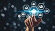© su - Hand pointing glowing hologram business icons on dark bokeh background