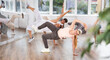 © JackF - Active young girl practicing break dance in training hall during dancing classes