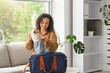 © Pixel-Shot - Mature businesswoman with sports bag sitting on sofa in office
