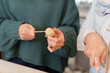 © itchaznong - Cooking Preparation. Friends peeling and preparing vegetables for a meal.